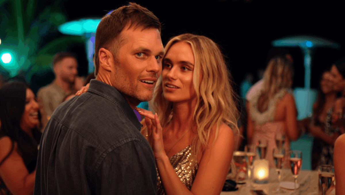 Alix Earle gets cozy with Tom Brady at St. Barts New Year's party, rubbing his back in steamy moment