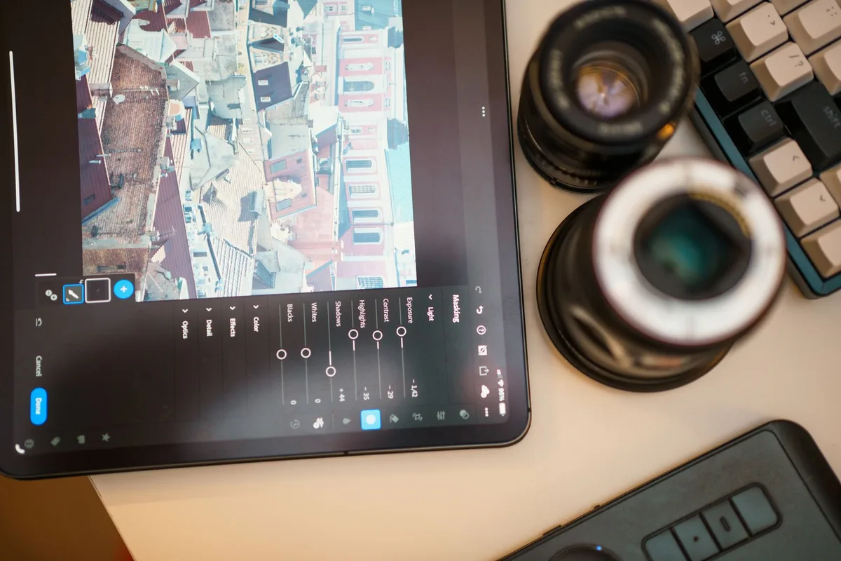 Creative professional using AI tools and software in a modern studio editing workspace.