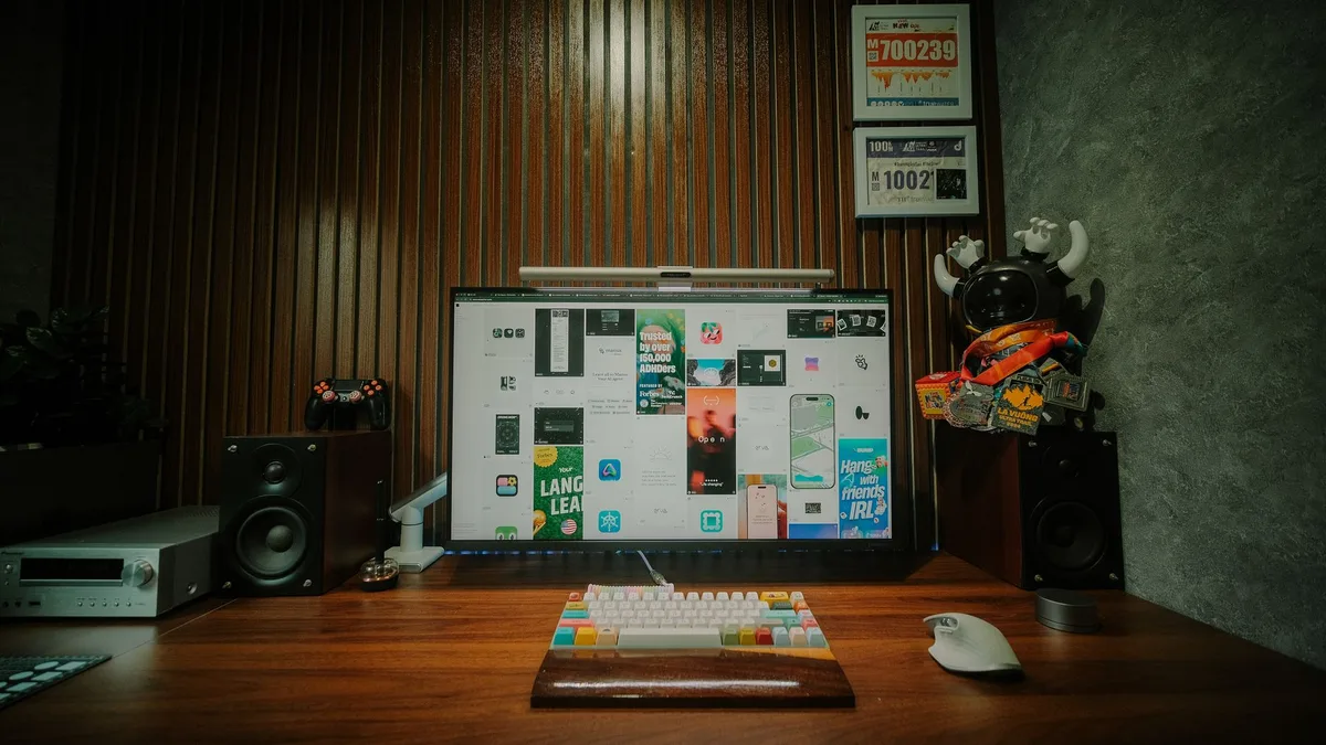 Modern electric standing desk with dual monitors in a clean, minimalist workspace