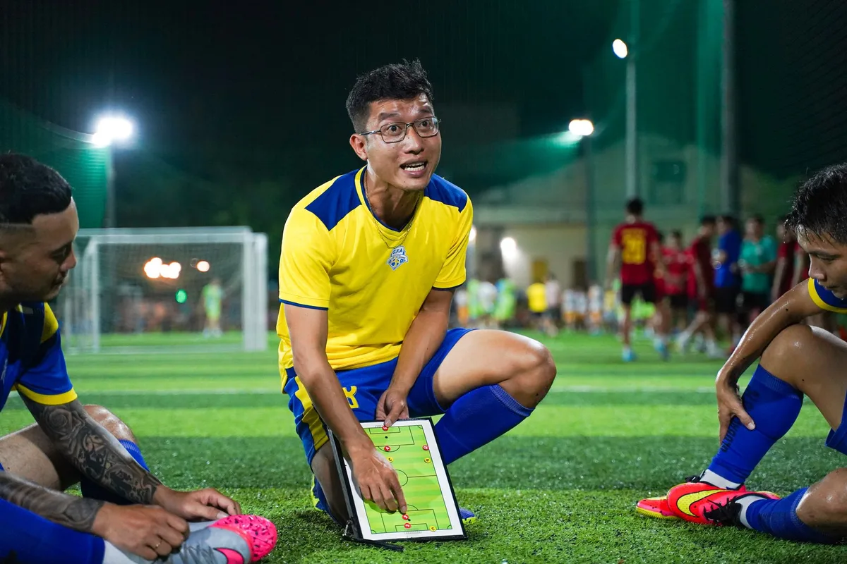 Football manager reviewing tactical formations and player positions