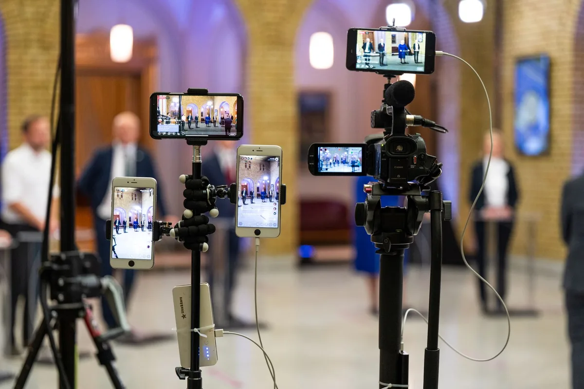 Multiple devices showing different streaming platforms and broadcast channels