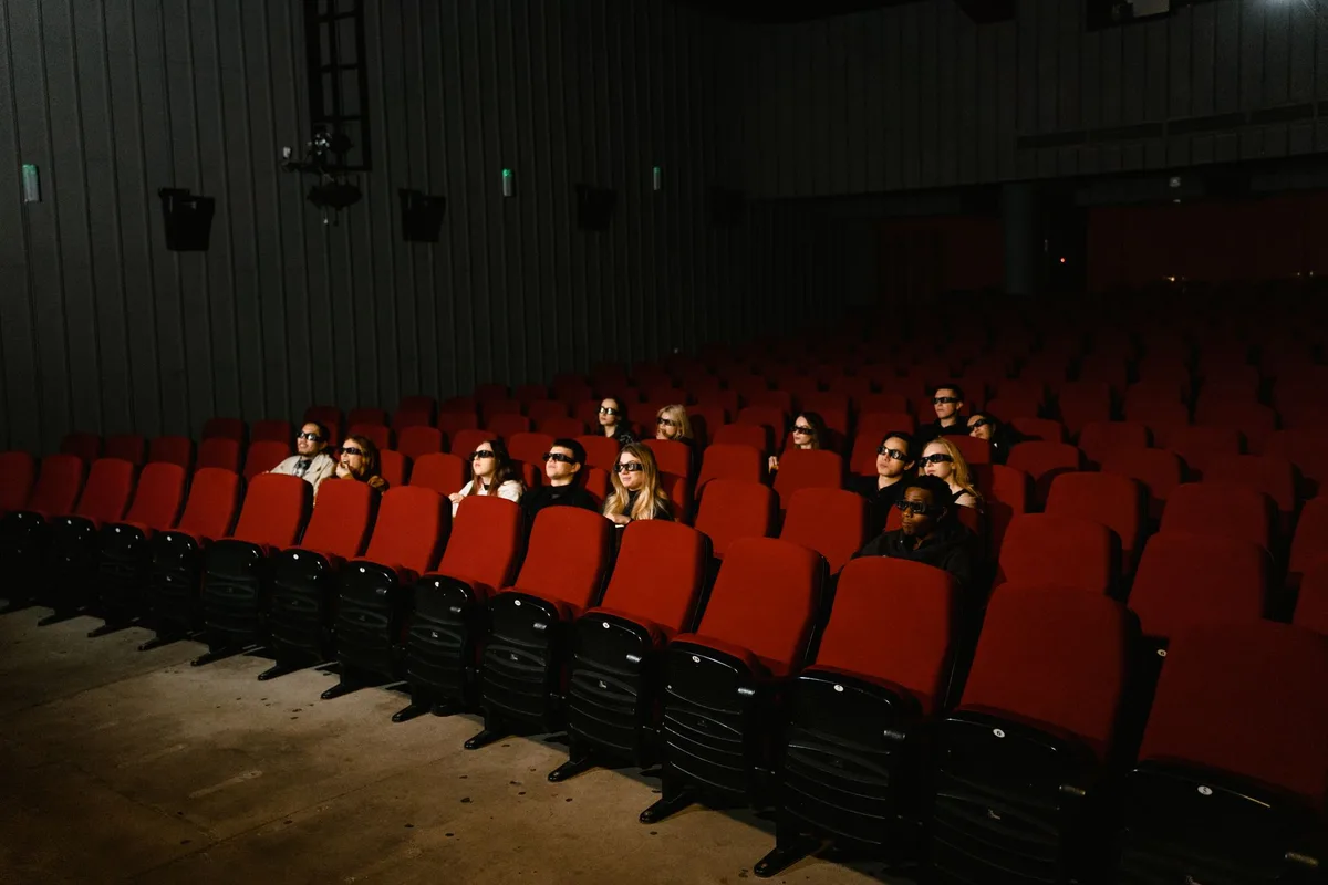 Cinema auditorium with panoramic ScreenX projection on side walls and main screen