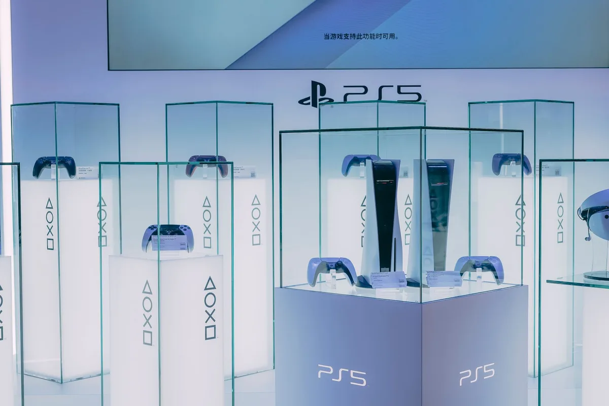 Wolverine-themed PS5 bundle with yellow controller and console covers displayed together