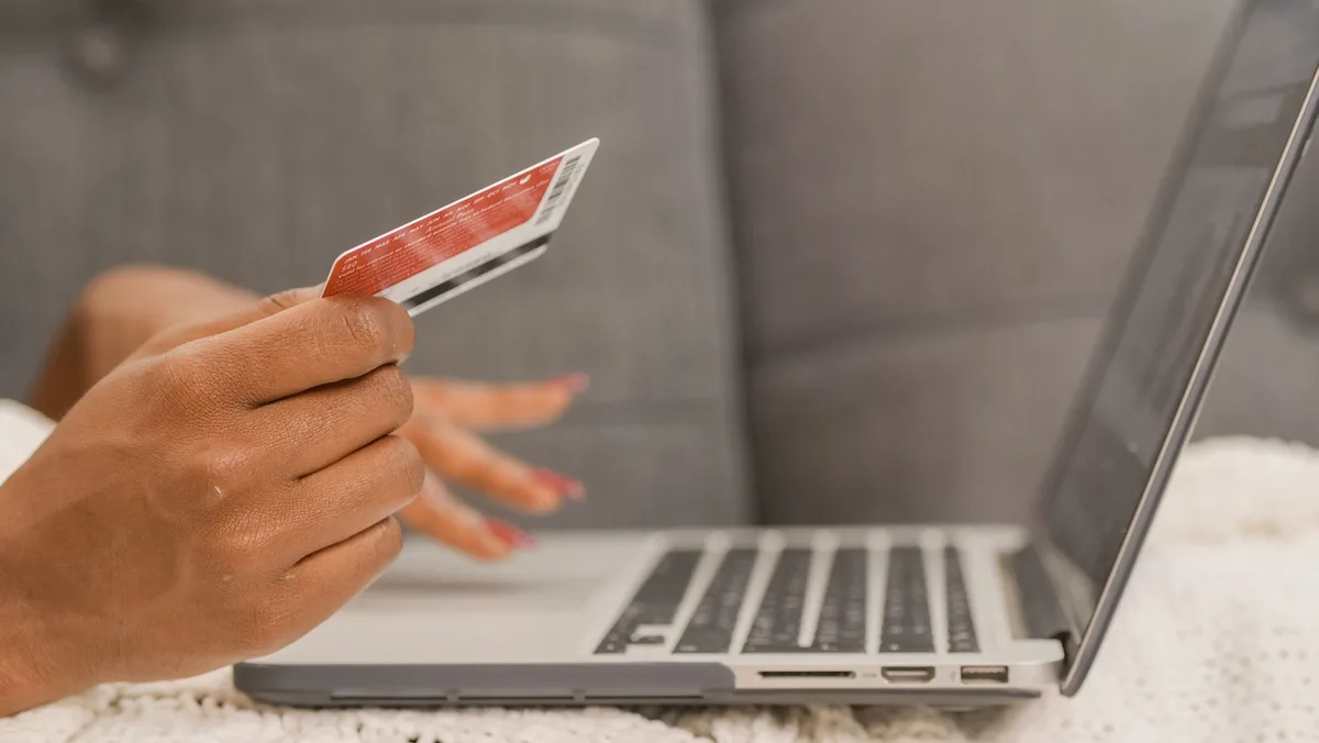 Shopper on laptop completing a purchase at an online retailer