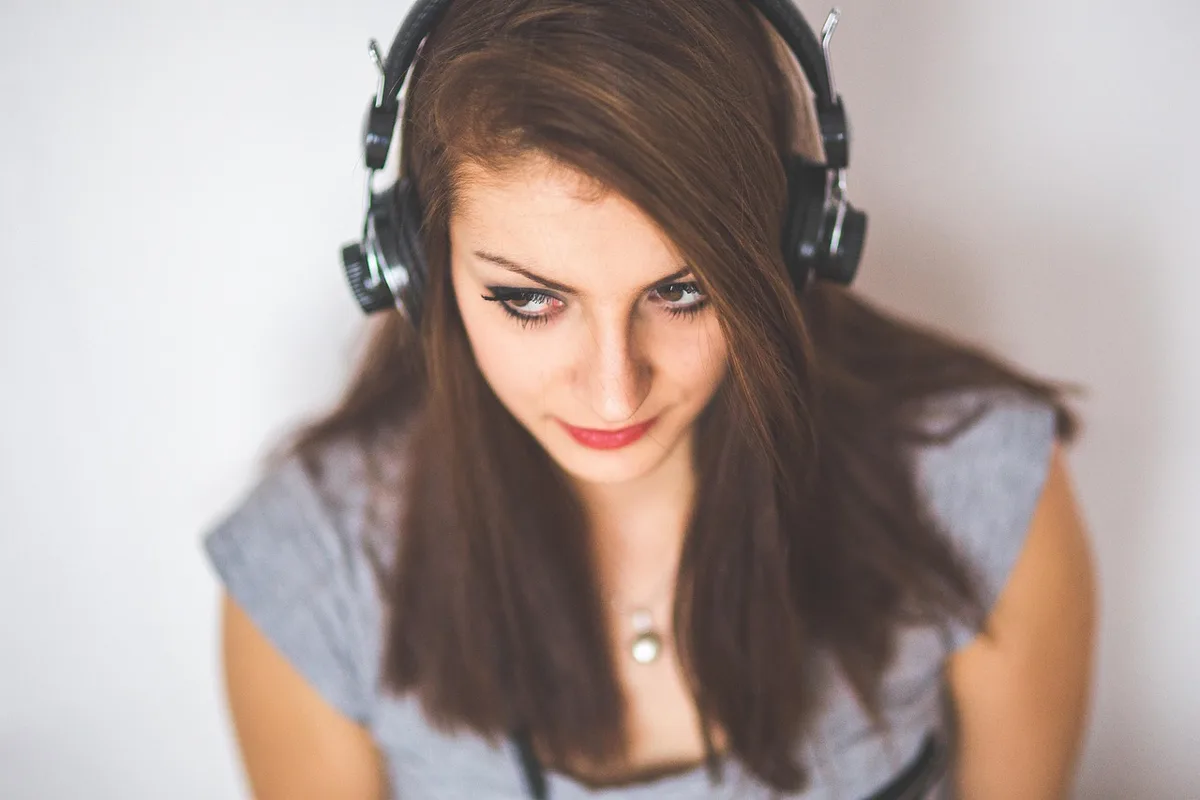 SteelSeries-style headset on a desk showing earcup and cable