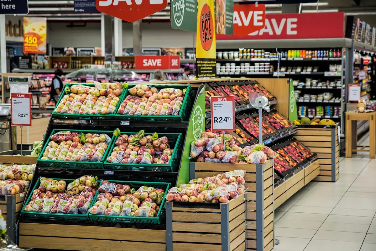 Shopper browsing store shelves and checking inventory availability
