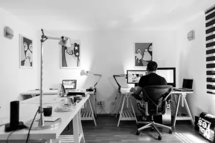 Sunlit production office with storyboard, director's chair and laptop