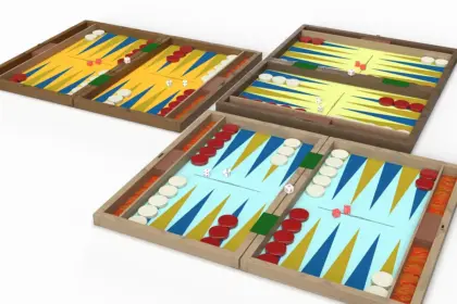 Family hands reaching across a sunny living-room table scattered with board game pieces