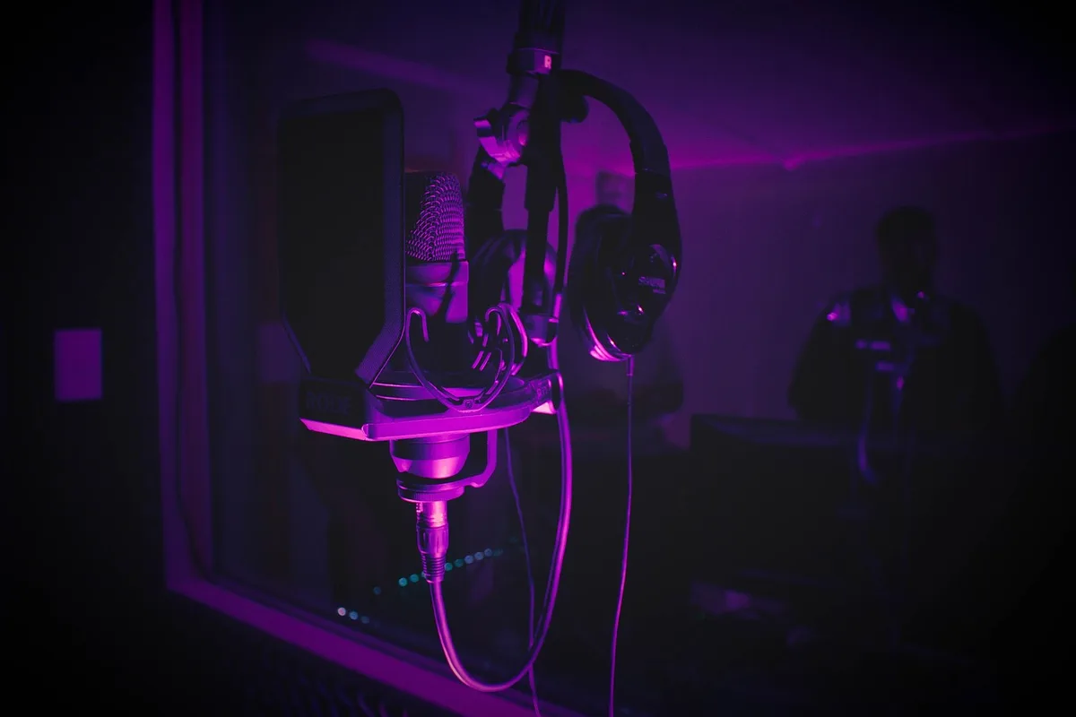 Gaming headset on desk with soundwave graphic indicating bright treble