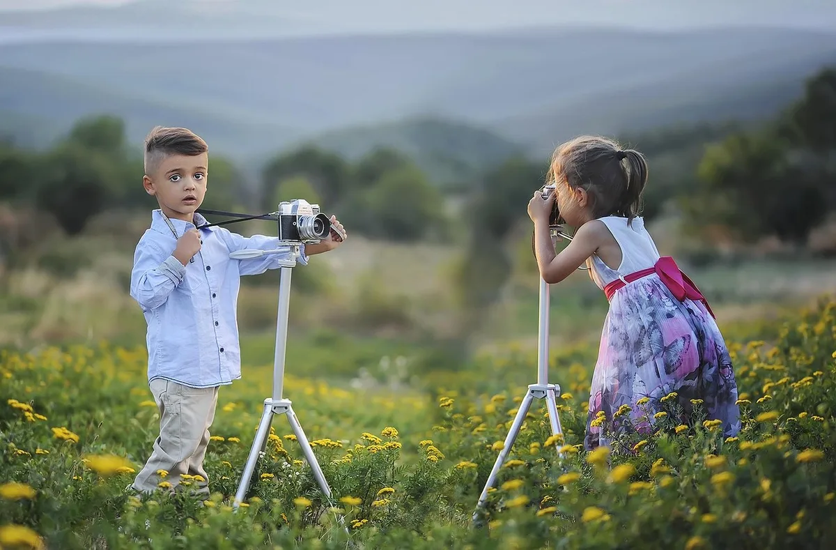 A camera and open journal on a table, evoking in-game photography and memories