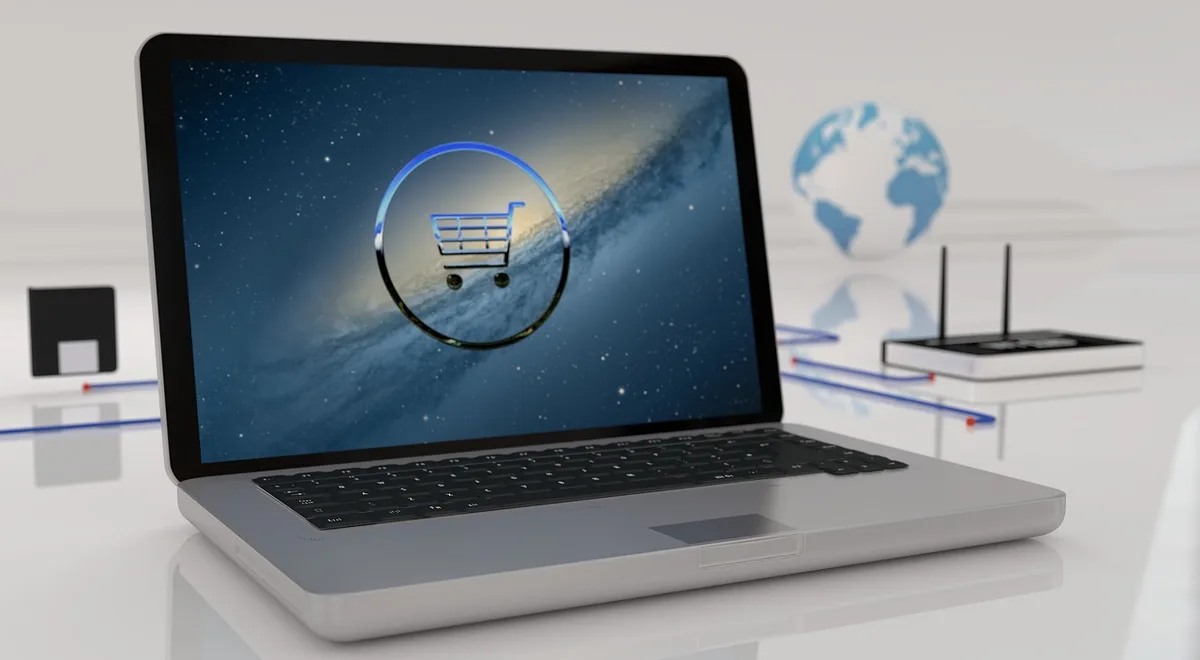 Close-up of hands using a laptop to browse online deals