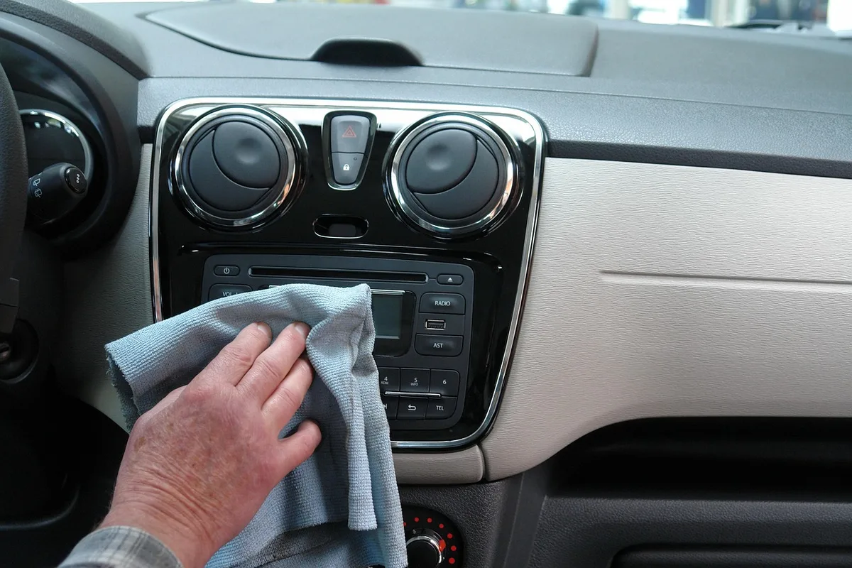 Vehicle touchscreen showing a playful Halloween-themed interface in daylight
